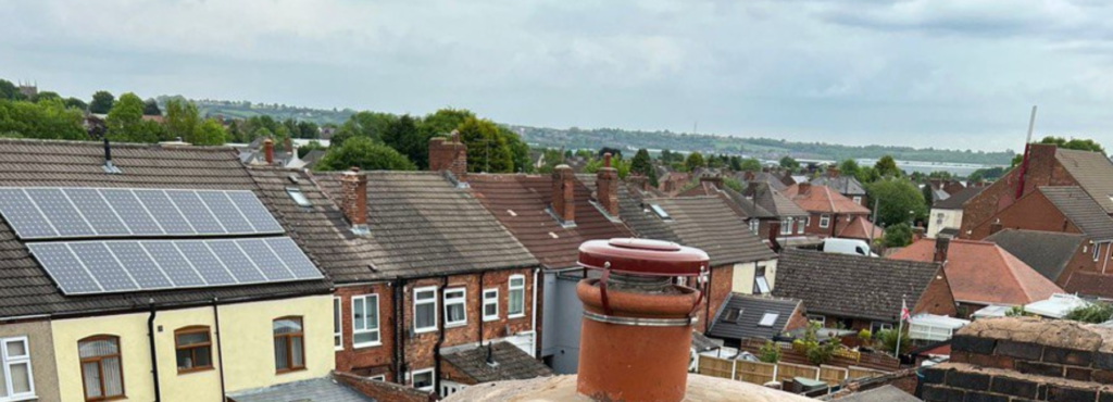 This is a photo taken from a roof which is being repaired by MCM Roofing Repairs Sherborne, it shows a street of houses, and their roofs