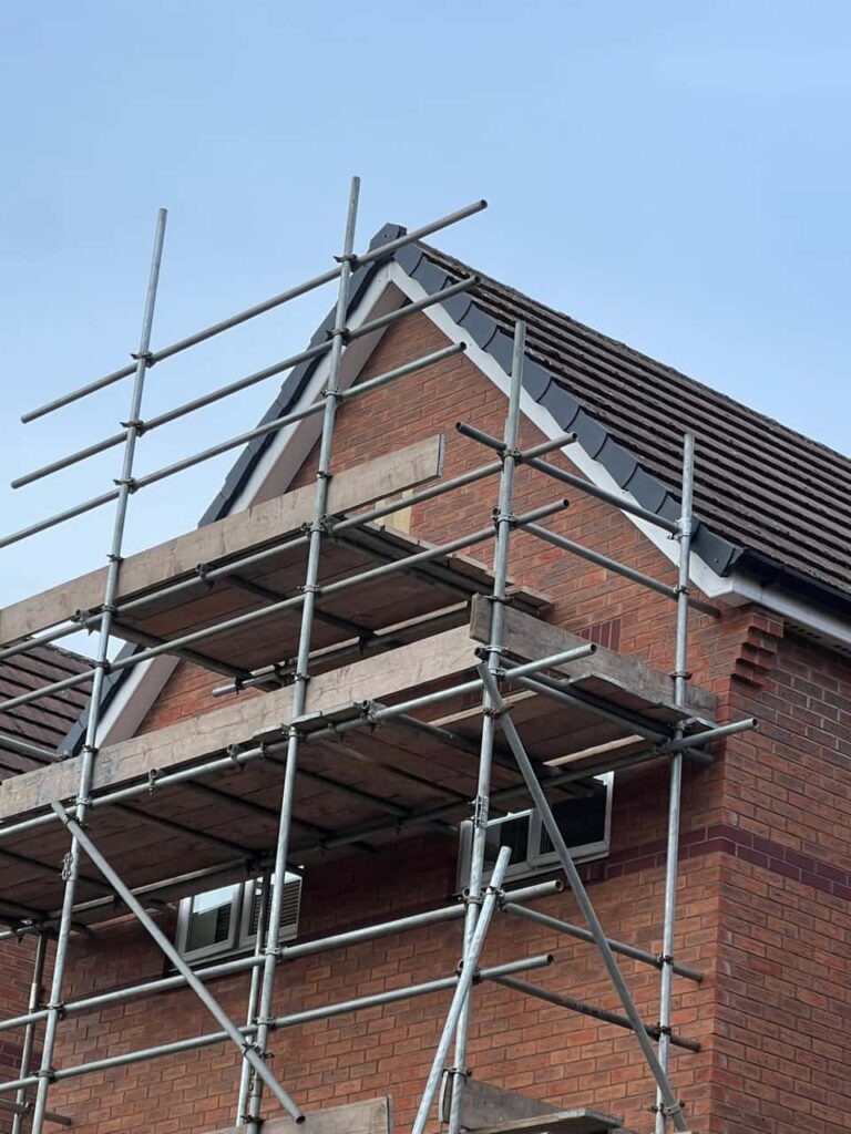 This is a photo of a roof which has just been repaired. There is a scaffold located at the gable end for access onto the roof. Works carried out by MCM Roofing Repairs Sherborne
