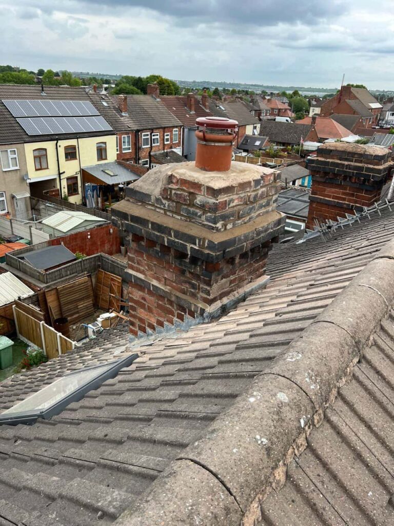 This is a photo taken from a roof which is being repaired by MCM Roofing Repairs Sherborne, it shows a street of houses, and their roofs